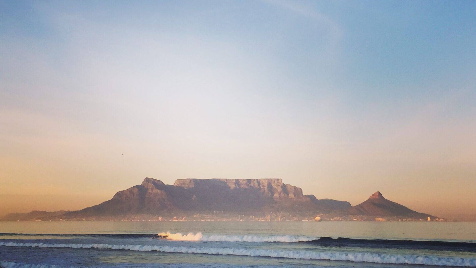 Table Mountain seen across Table Bay from the beach at Bloubergstrand, Cape Town